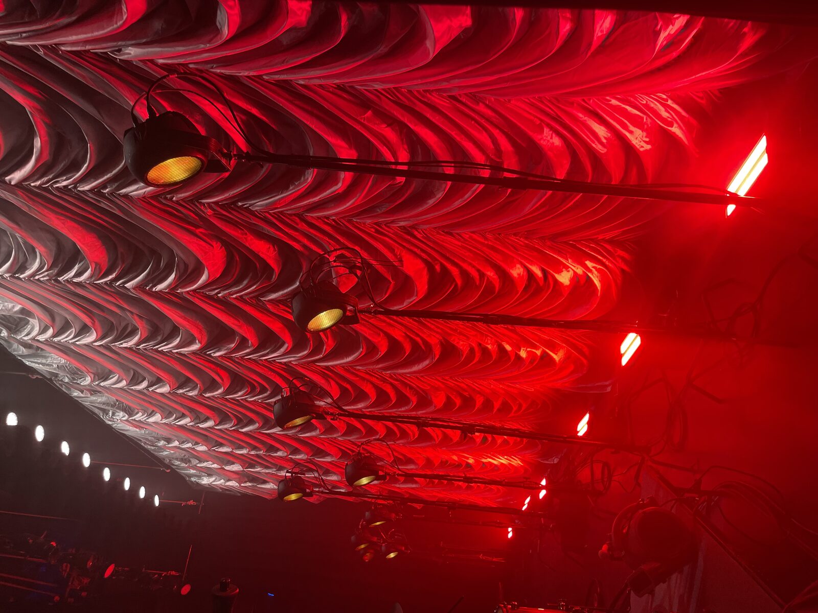 Silver Austrian swoop drape overhead view with red lighting