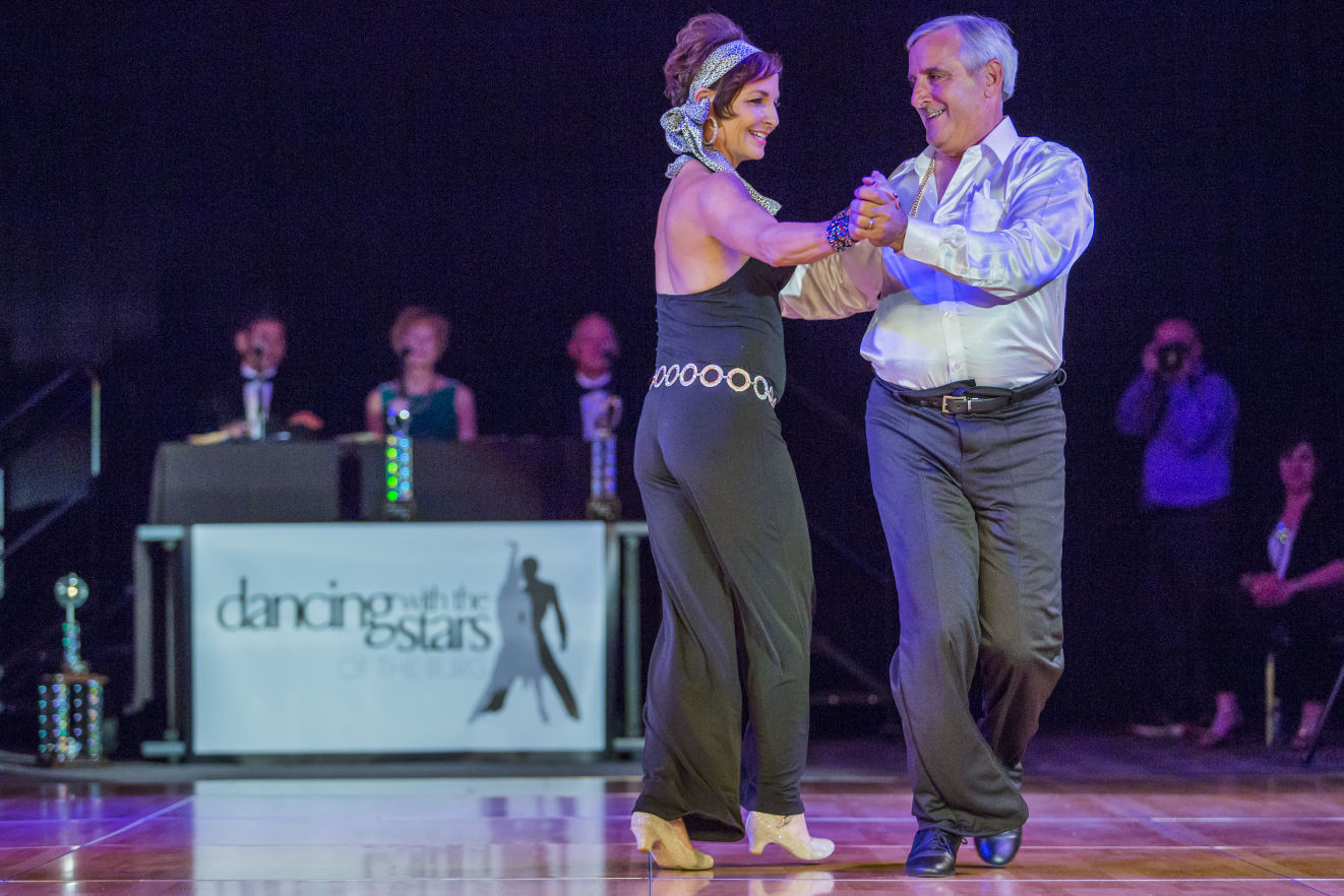 Purple-lit drape backdrop at Dancing with the Stars of the Burg